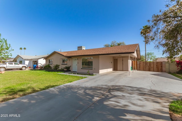 ranch-style home with a carport and a front lawn