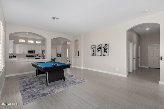 playroom featuring light wood-type flooring, visible vents, baseboards, and pool table