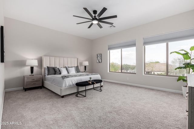 bedroom with carpet flooring and multiple windows