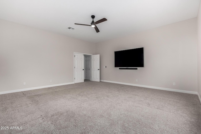 unfurnished bedroom with baseboards, ceiling fan, carpet flooring, and visible vents