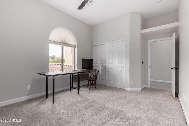 office with a ceiling fan, carpet flooring, visible vents, and baseboards