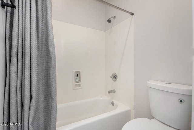 bathroom with toilet and shower / tub combo with curtain