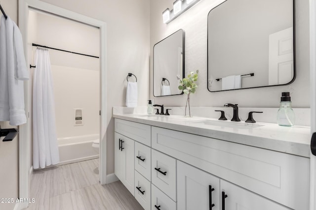 full bath with a sink, double vanity, toilet, and shower / bathtub combination with curtain