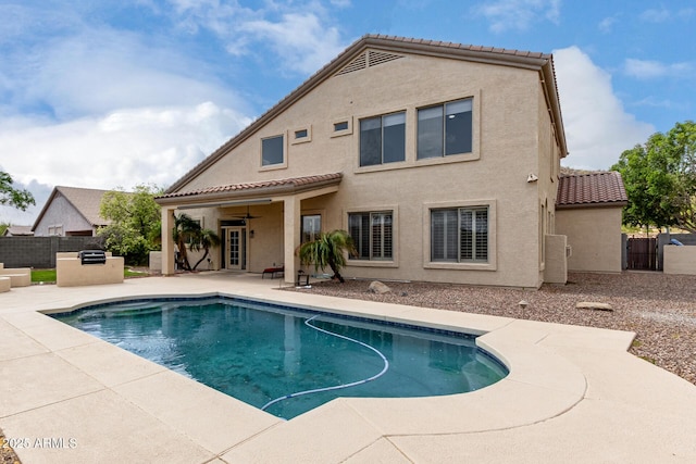 view of pool with a patio area, a fenced in pool, and fence