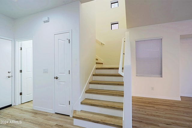 stairway featuring hardwood / wood-style flooring