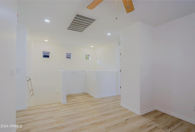 clothes washing area with light wood-type flooring