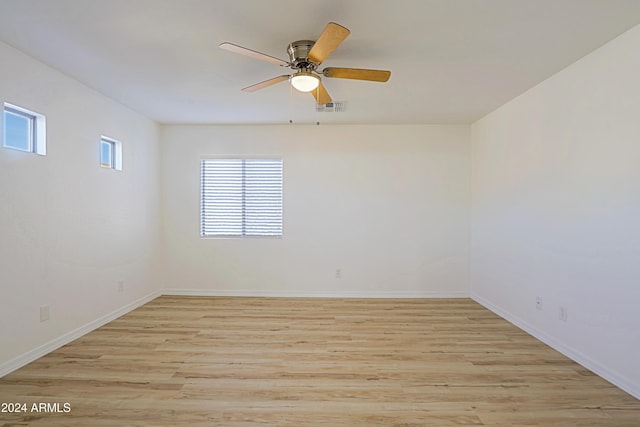 unfurnished room featuring light hardwood / wood-style floors and ceiling fan