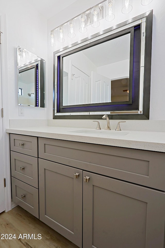 bathroom featuring hardwood / wood-style flooring and vanity