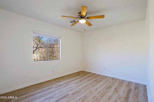 empty room featuring ceiling fan and light hardwood / wood-style floors