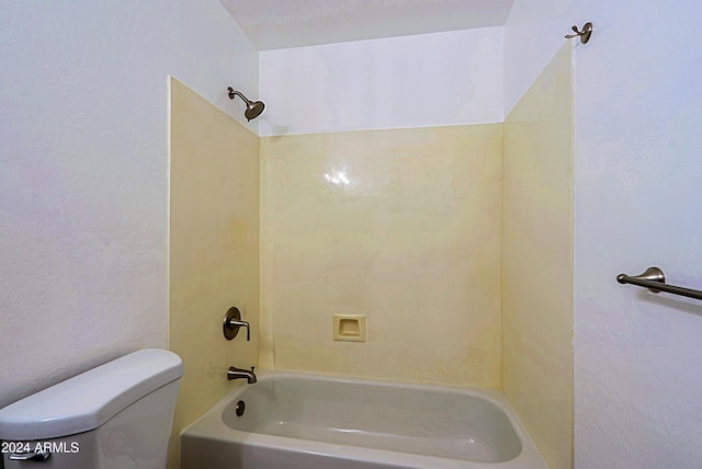 bathroom with toilet and tub / shower combination