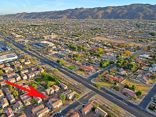 birds eye view of property featuring a mountain view