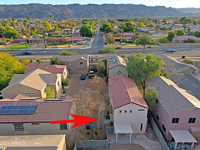 birds eye view of property featuring a mountain view