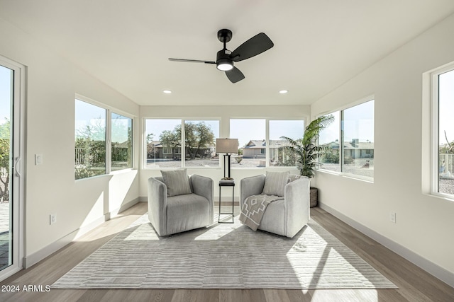 sunroom / solarium with ceiling fan and a healthy amount of sunlight