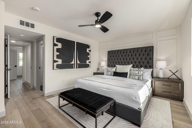 bedroom featuring ceiling fan and light wood-type flooring