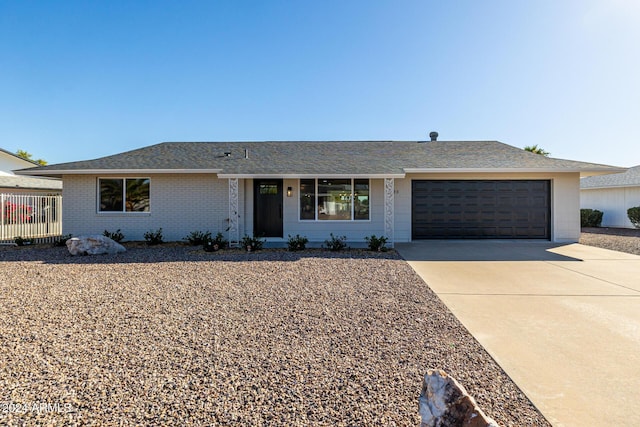 ranch-style home featuring a garage