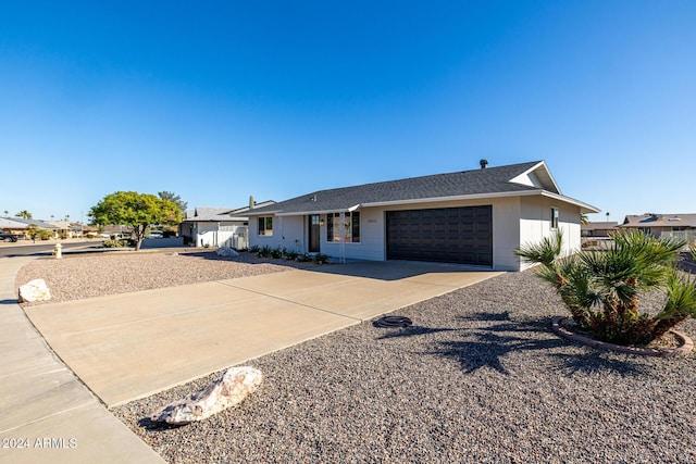 single story home featuring a garage