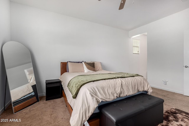 bedroom with baseboards, carpet, and a ceiling fan