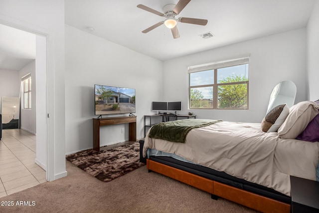 bedroom with visible vents, carpet, tile patterned floors, and multiple windows