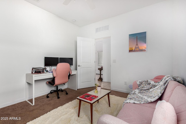 home office featuring baseboards, ceiling fan, carpet flooring, and visible vents