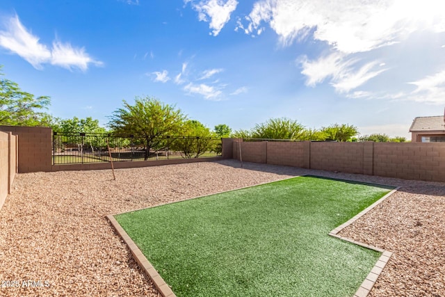 view of yard with a fenced backyard