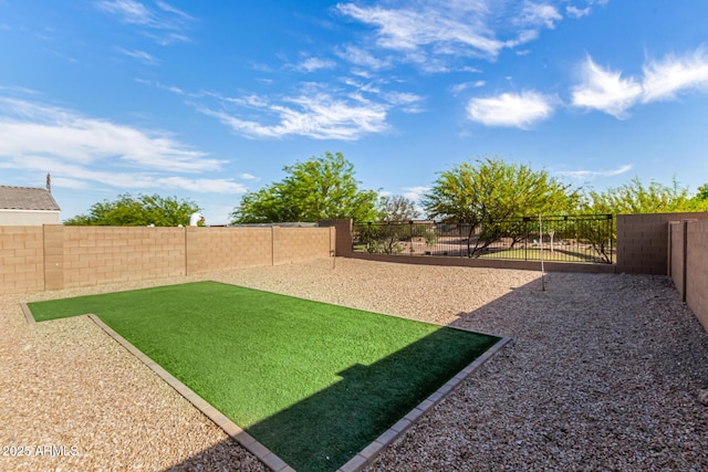 view of yard with a fenced backyard