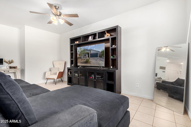 tiled bedroom featuring a ceiling fan and baseboards