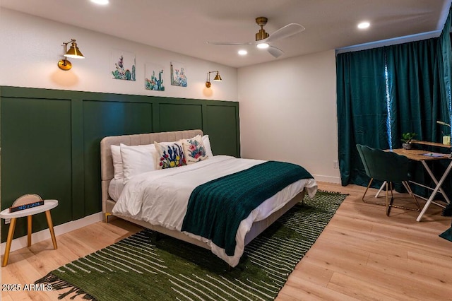 bedroom featuring hardwood / wood-style flooring and ceiling fan