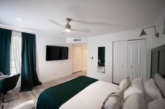 bedroom with ceiling fan and light hardwood / wood-style floors