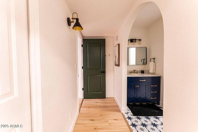 bathroom with hardwood / wood-style floors and vanity