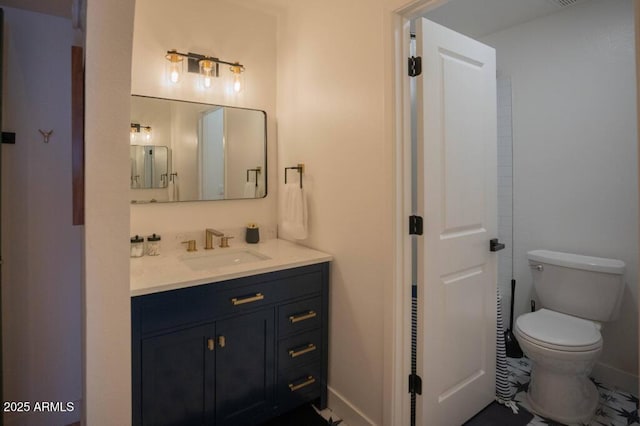 bathroom with toilet and vanity