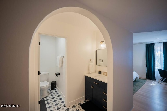 bathroom featuring toilet and vanity