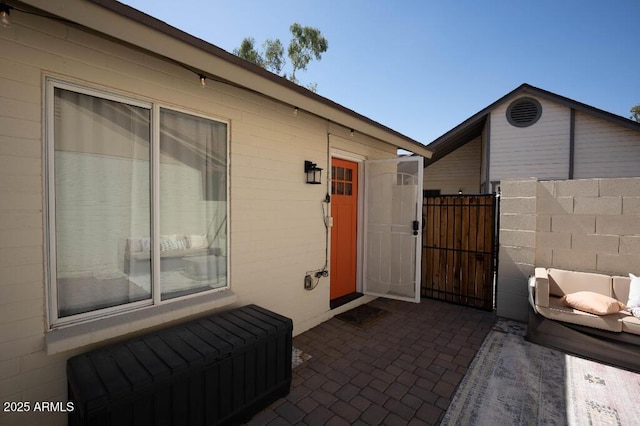 entrance to property featuring a patio area and radiator heating unit