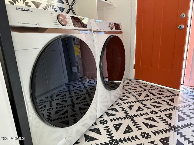 clothes washing area featuring separate washer and dryer and tile patterned floors