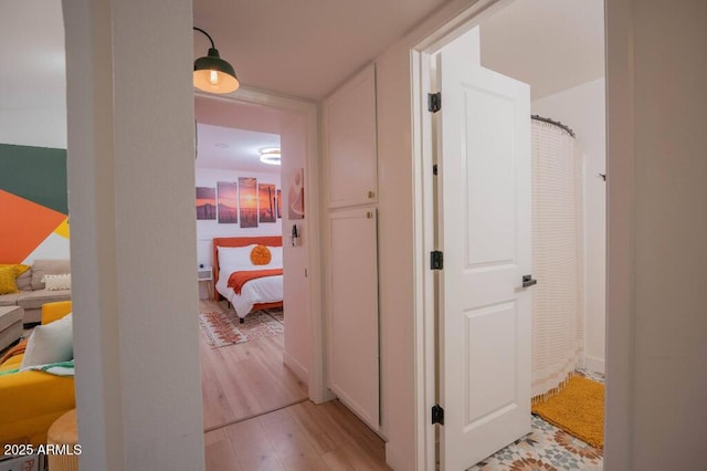 hallway with light wood-type flooring