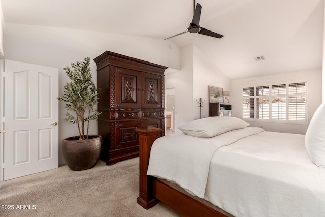 bedroom with ceiling fan, lofted ceiling, and light carpet