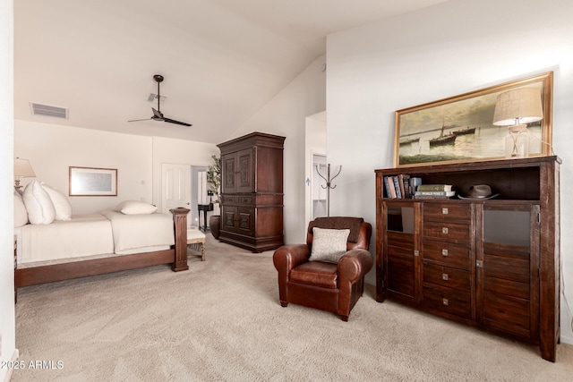 bedroom with light carpet and lofted ceiling