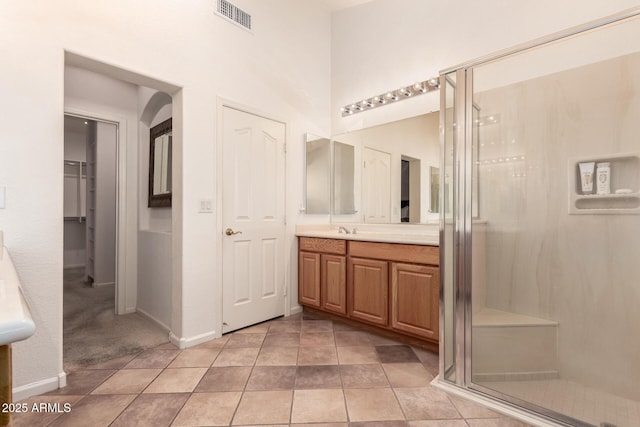 bathroom with vanity and an enclosed shower