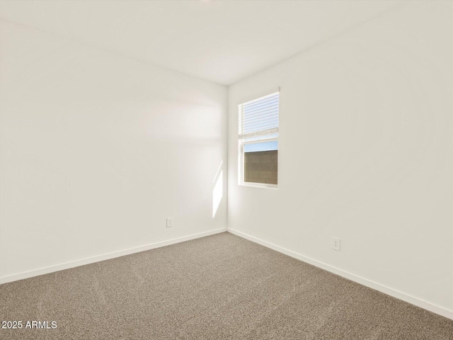 empty room featuring carpet flooring