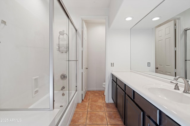 full bathroom with vanity, tile patterned floors, combined bath / shower with glass door, toilet, and recessed lighting