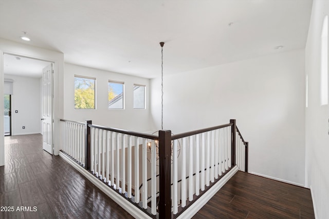 stairs with recessed lighting, wood finished floors, and a wealth of natural light