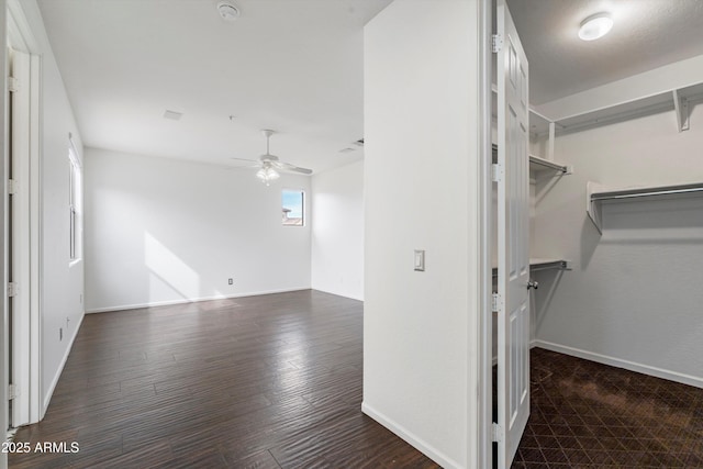 interior space featuring ceiling fan and wood finished floors