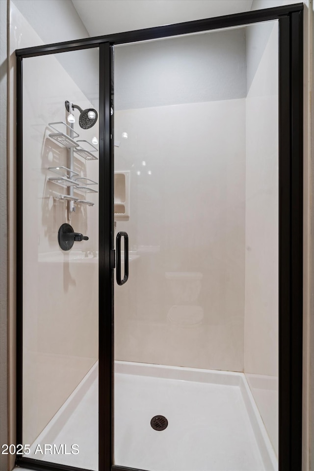 bathroom with a stall shower