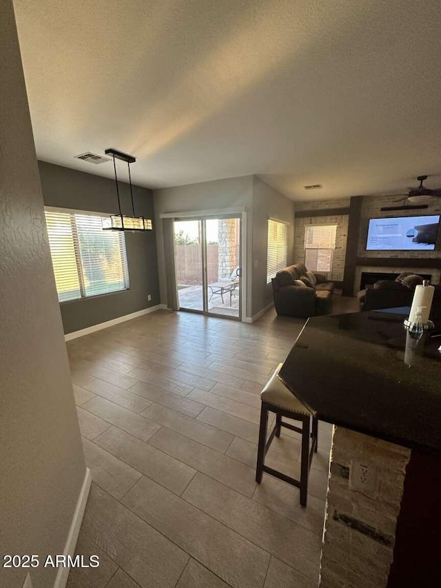 28306 N 25th Dl, Phoenix, AZ 85085 - tiled living room featuring baseboards and a textured ceiling