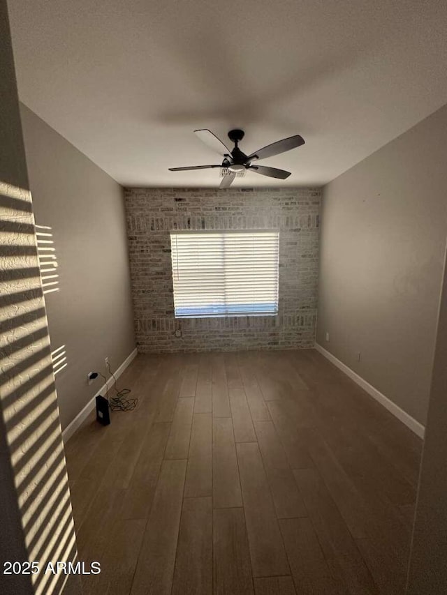 28306 N 25th Dl, Phoenix, AZ 85085 - empty room featuring wood finished floors and a ceiling fan