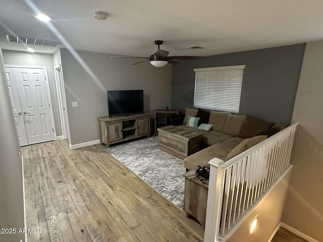 28306 N 25th Dl, Phoenix, AZ 85085 - living room with a ceiling fan and wood finished floors