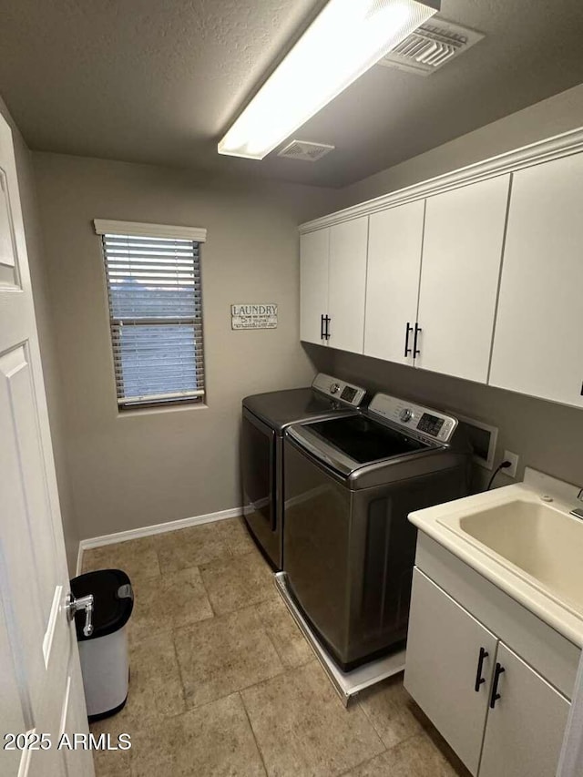 28306 N 25th Dl, Phoenix, AZ 85085 - laundry area featuring washer and dryer and cabinet space