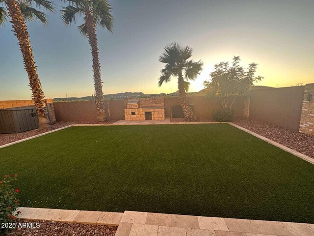 28306 N 25th Dl, Phoenix, AZ 85085 - yard at dusk featuring a fenced backyard