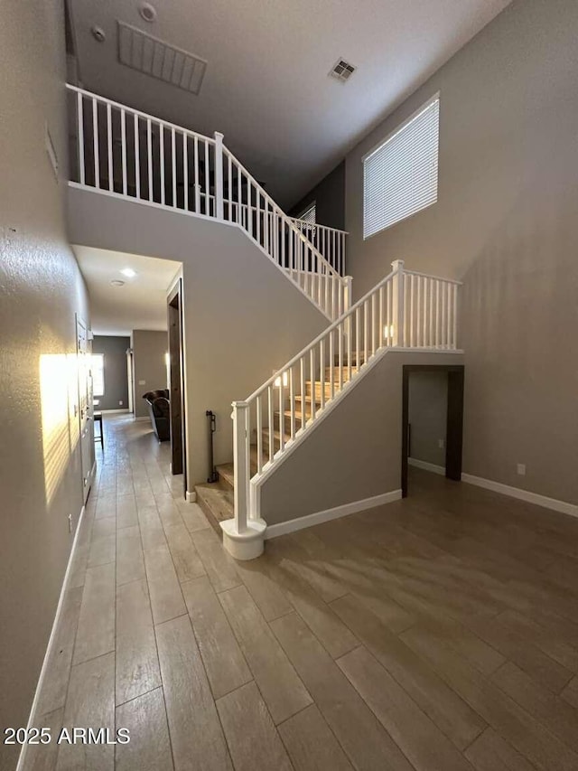 28306 N 25th Dl, Phoenix, AZ 85085 - stairs with wood-type flooring and a high ceiling