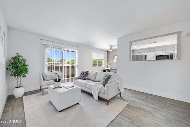 616 S Hardy Dr Unit 203, Tempe, AZ 85281 - living area featuring light wood-style flooring and a ceiling fan