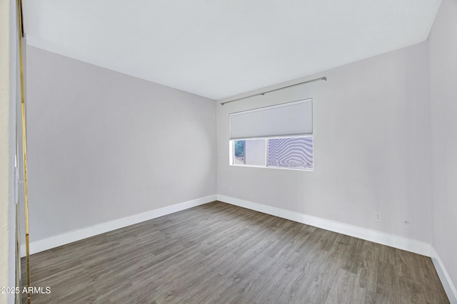 616 S Hardy Dr Unit 203, Tempe, AZ 85281 - spare room with wood finished floors and baseboards